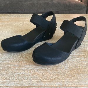 Black sling back shoes.